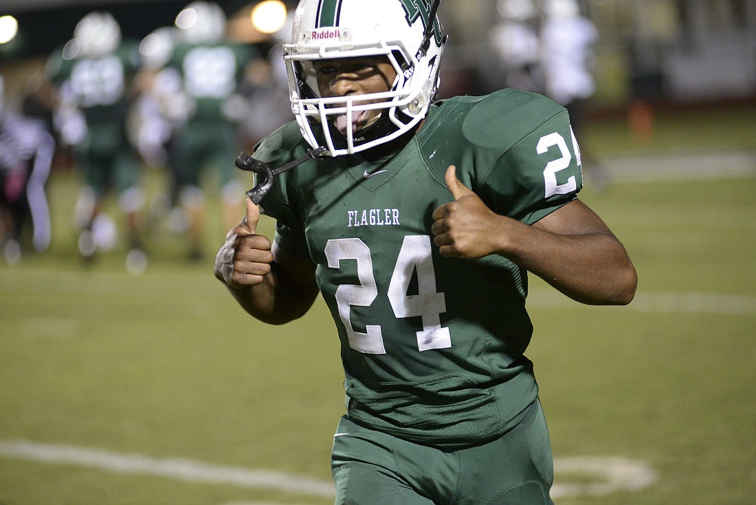 L'Darius Smith gives two thumbs up after scoring a touchdown in the  Bulldogs win against West Port.