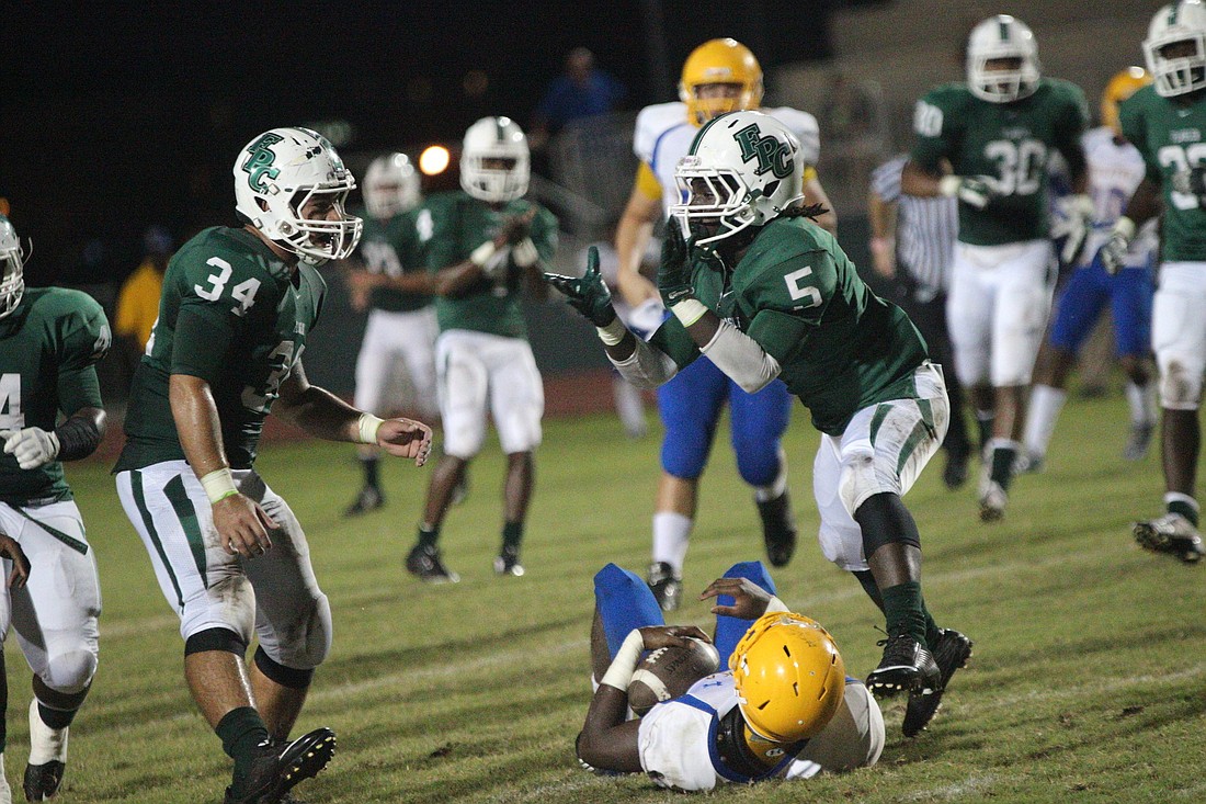 Kevin Pogue celebrates a tackle for a loss in FPCÃ¢â‚¬â„¢s win over Palatka Friday, Oct. 10.