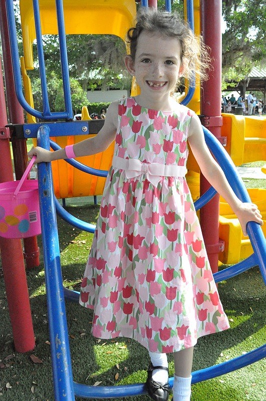 Lindsay Soss, 7, headed to the playground after the Easter egg hunt.
