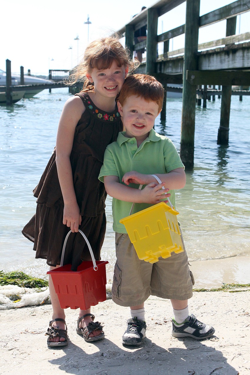 Brianna and Brendan Massey pose by the water after collecting eggs.