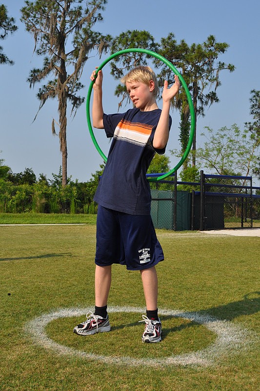 Jacob Lothan, 13, became a human target for the hula hoop toss.