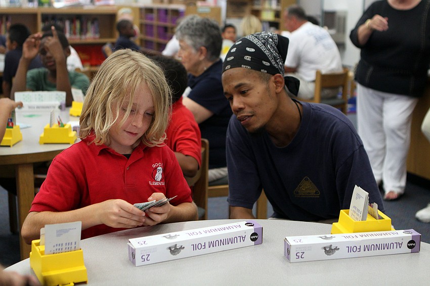 Hunter DeSerio shows off his bridge skills to James Foster during the bridge club's final meeting Monday, May 23 inside Gocico Elementary School's Media Center.