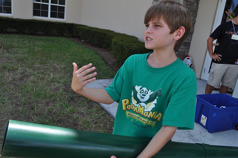 Kyle Wray, 12, shot pandas out of a tube for children to catch.