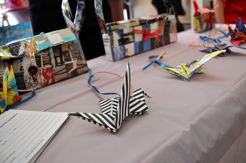 Peace cranes and magazine purses created by girls at Girls Inc. were for sale Saturday, June 25 inside Simply Spoiled.