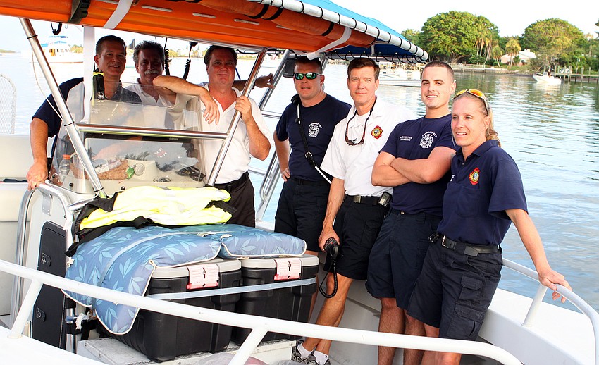 The Longboat Key Fire and Paramedic team pose together on their boat Saturday, July 2 prior to the fireworks display.