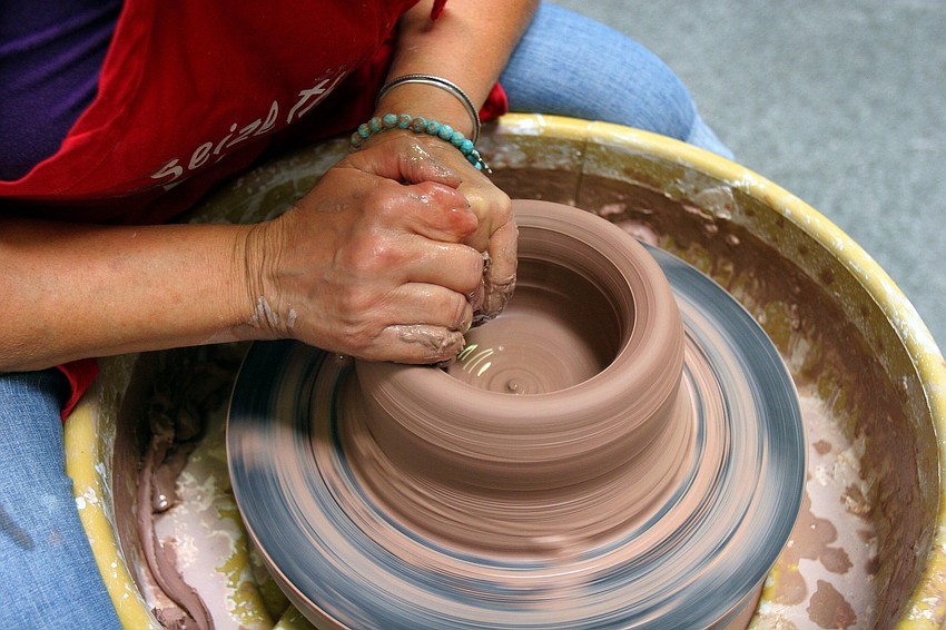 Carla Oâ€™Brein works on making a big bowl out of clay on the wheel Wednesday, June 15 at Carlaâ€™s Clay. Oâ€™Brein has been working with clay for 35 years and has been teaching pottery classes since 1997.