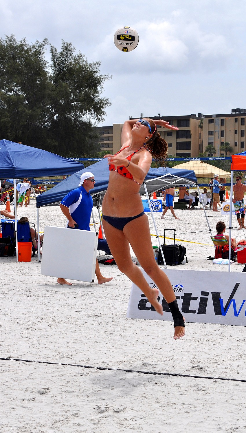 Livia Mendonca serves the ball on Saturday, July 9 at Siesta Key Beach.