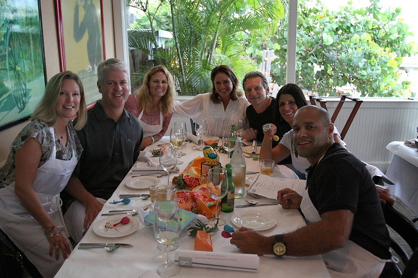 Gretchen and Brian Kennelly, Claudia Zorovich, Jaymie Klauber, Tom Knieriem, and Julia and Giovanni DeCastro pose together Friday, July 22 during the Interactive Mexico dinner at Pattigeorgeâ€™s.