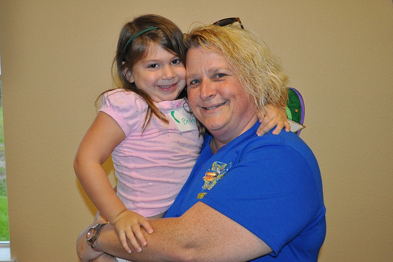 Bella Talerico, 4, made sure to get a hug from volunteer Kandi Ross.