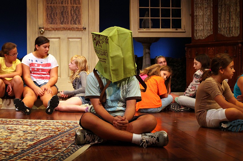 Andrew Stevens puts a bag over his head during his monologue â€œCharlie Brown Lunchâ€.