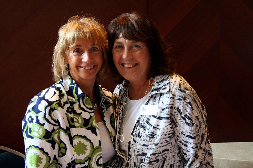 Andrea Rogers and Cindy Guest of the League of Women Voters pose together Saturday, Aug. 20 during the 91st Anniversary Celebration For Womenâ€™s Equity at the Hyatt Regency Sarasota.