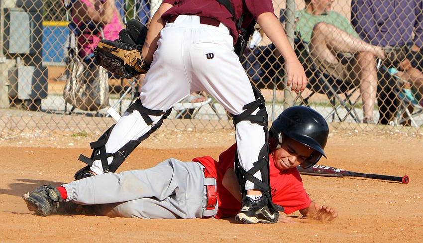 Brandon Viera, 7, slides into home during the final game of the Spring season Monday, May 9 out at Twin Lakes Park.