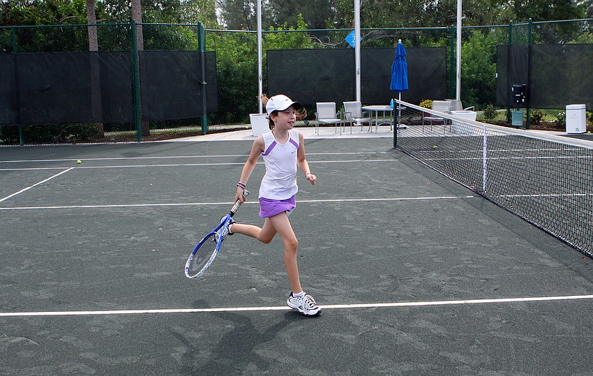 Dara Grocer runs to the other side of the court during an intense game of Queen of the Court during Longboat Key Club's Tennis Camp Monday, June 6 at Longboat Key Club's Tennis Gardens.