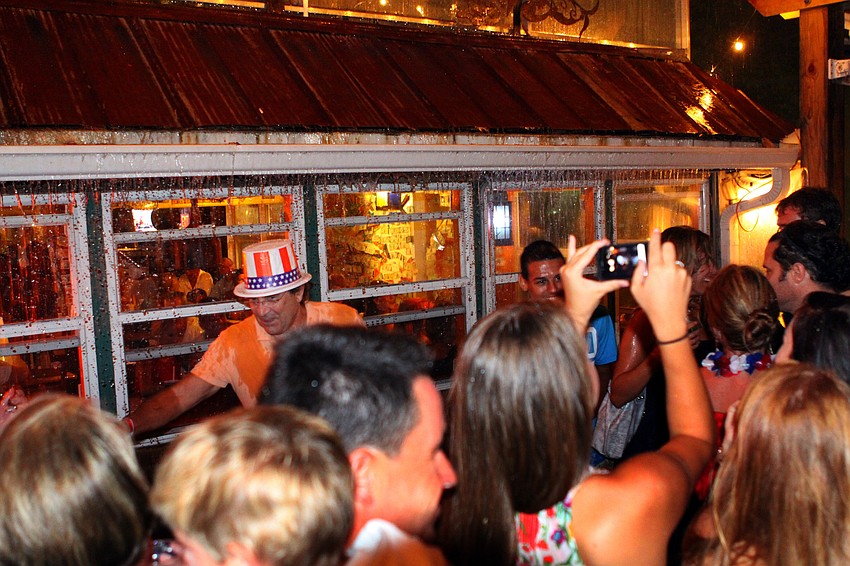 Rain entered into the pavilion by gushing down the cast iron awnings on the side of Mar Vista.