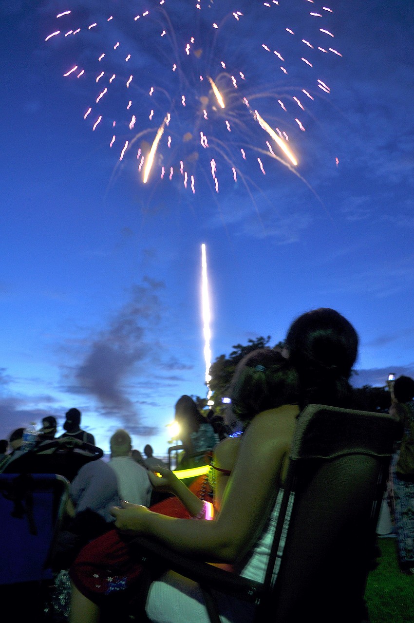 Melanie Belair and Emily Hobause watch the Bayfront Fireworks Spectacular Monday, July 4 at Island Park.