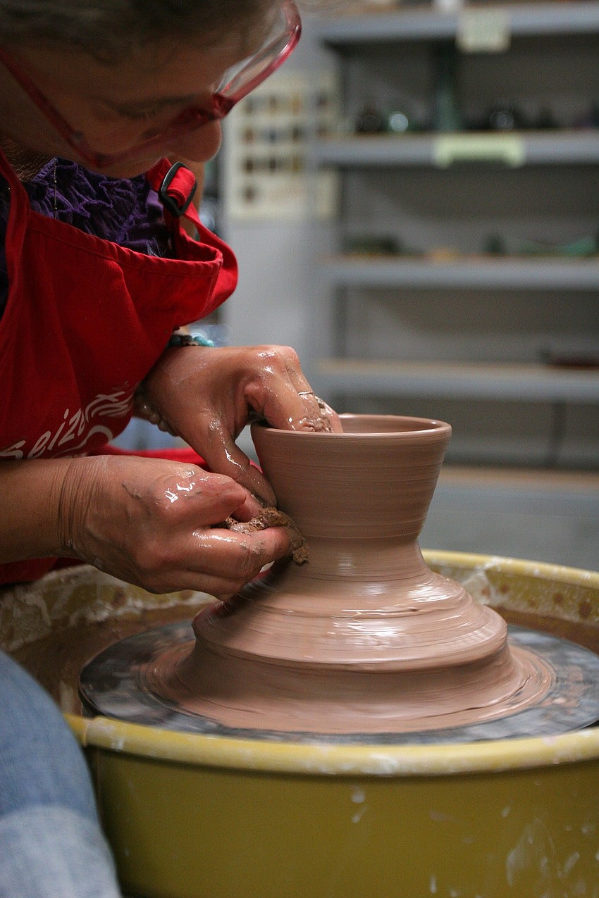 Carla Oâ€™Brein works on making a big bowl out of clay on the wheel Wednesday, June 15 at Carlaâ€™s Clay. Oâ€™Brein has been working with clay for 35 years and has been teaching pottery classes since 1997.