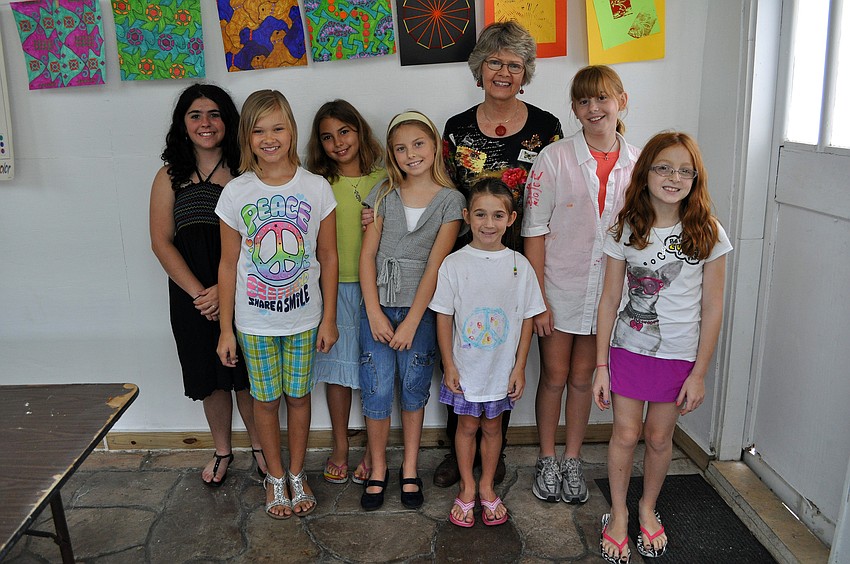 Charlotte Smith poses with her students on the last day of class.