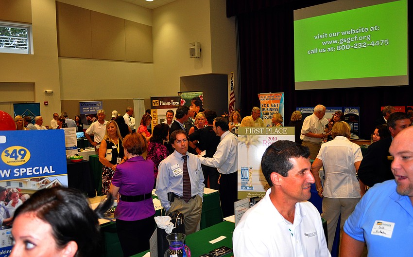 People mingle with one another Wednesday, July 13 during the Sarasota Prime Time event presented by The University of South Florida â€“ Sarasota Manatee at the Girl Scouts of Gulfcoast Florida.