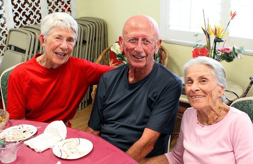 Kathleen and Donald Semisch pose with Betty Horne Saturday, July 16 at the Christ Church and Spanish Main fish fry.