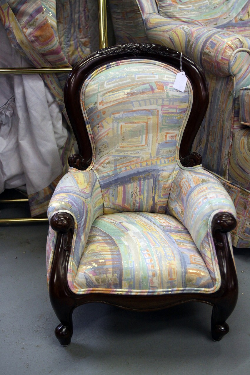 A matching miniature chair was in the larger room at the estate sale Friday, July 22 at the Airport Mall.