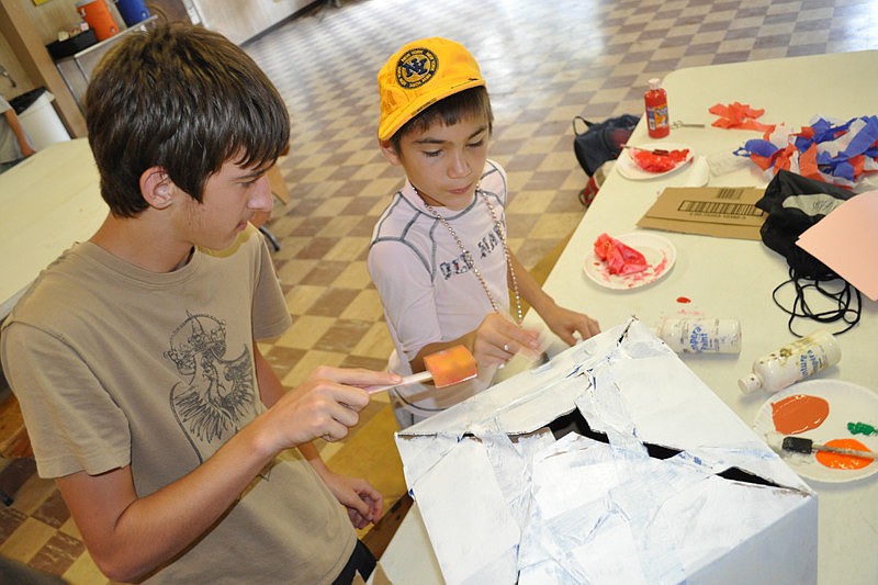 Lane Williams, 15, and Donald Perry, 13, worked hard on their Ultimate Pillow Fighting Championship trophy.