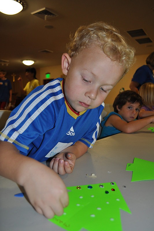 Drew Witte, 4, worked intently on his Christmas tree craft.