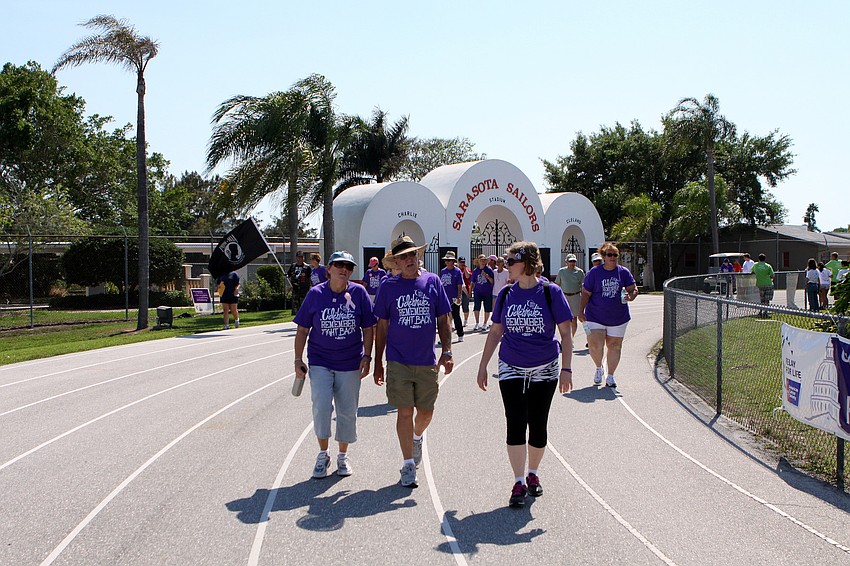 The survivor's make their first lap around the field on Saturday, April 9 at Sarasota High School.