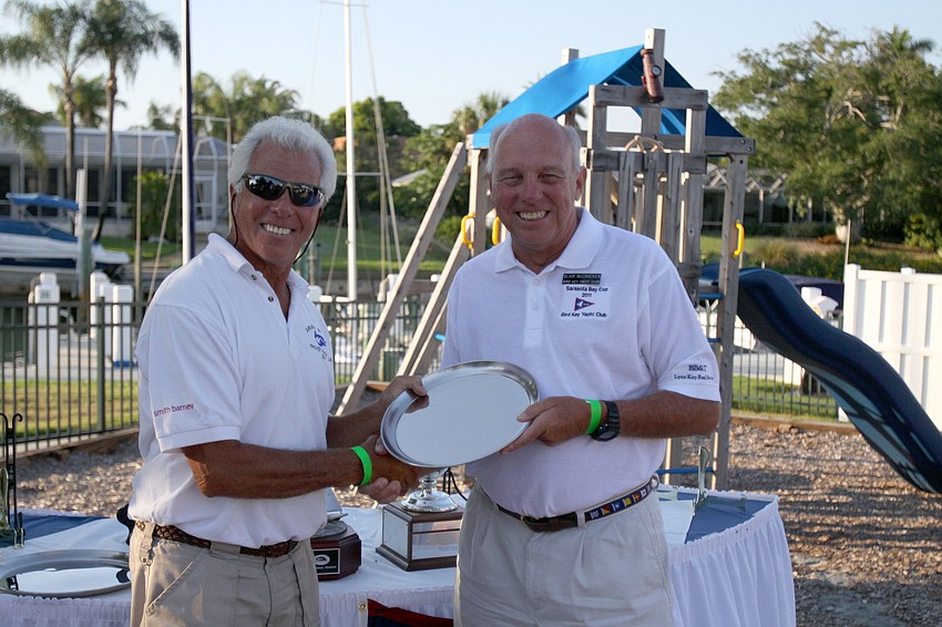 Commodore Bob Baime congratulates Bird Key Yacht Club member Blair McCracken for coming in 2nd in the Cruising Division Saturday, May 7 in the Sarasota Bay Cup at Bird Key Yacht Club.