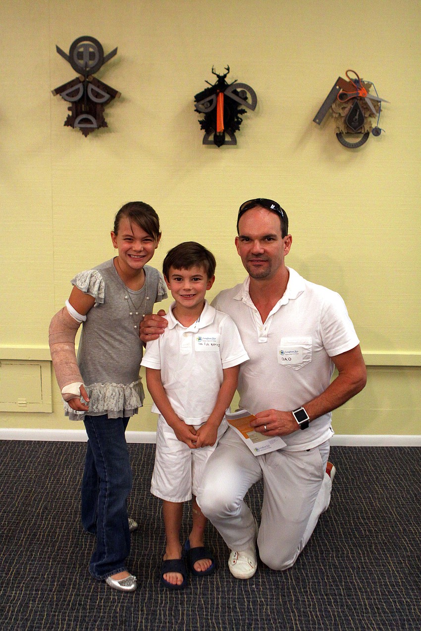 Olivia, Lex and Jeff Schwartz have a good time together at the opening of the RCAD Creatives Exhibition Thursday, May 19 at Longboat Key Center for the Arts.