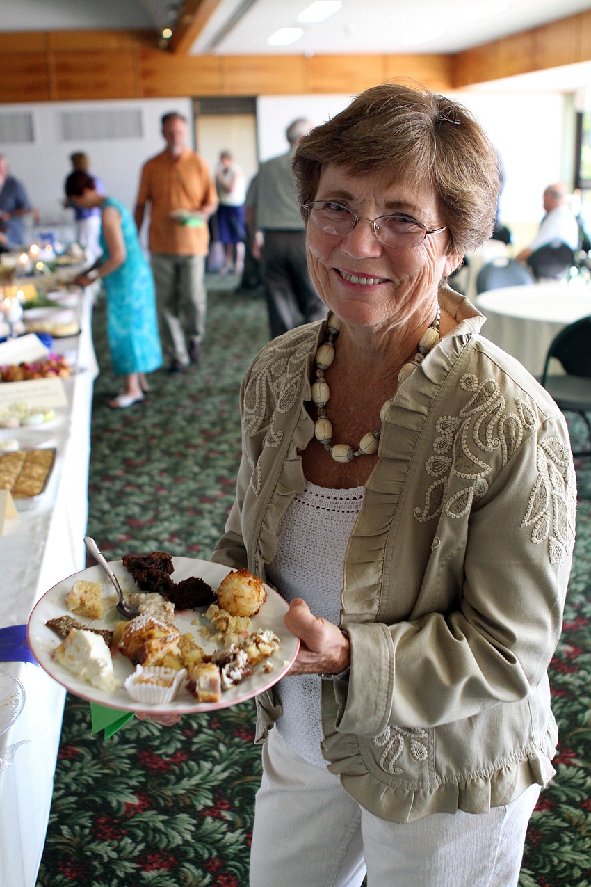 Marty Hillerich shows off her plate of desserts at Family Promises' Third Annual Just Desserts event Friday, May 20 at Selby Garden's Great Room by the Bay.