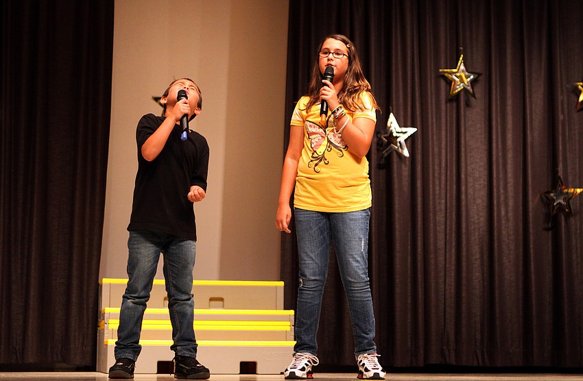 Alex, 3rd grade, and Katherine, 5th grade, Barbieri sang a duet to 