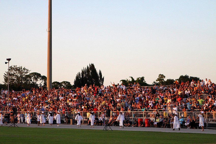The crowd cheered for the over 475 Sarasota High School seniors who made their way onto the football field as the sun set Friday, June 3 at Sarasota High School's graduation at Cleland Stadium.