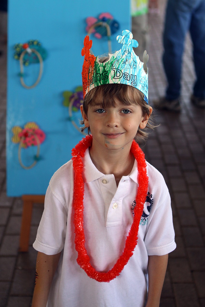 Logan Moskal wears his World Oceans Day crown during World Ocean Day Family Festival Sunday, June 5 at Mote Aquarium.