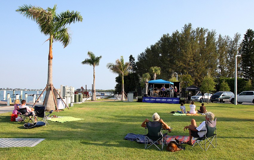 People enjoy sitting out at on the lawn listening to Soul R Coaster during the Sarasota Yacht Club's 1st ever Concert on the Lawn event Saturday, June 11 at the Sarasota Yacht Club.