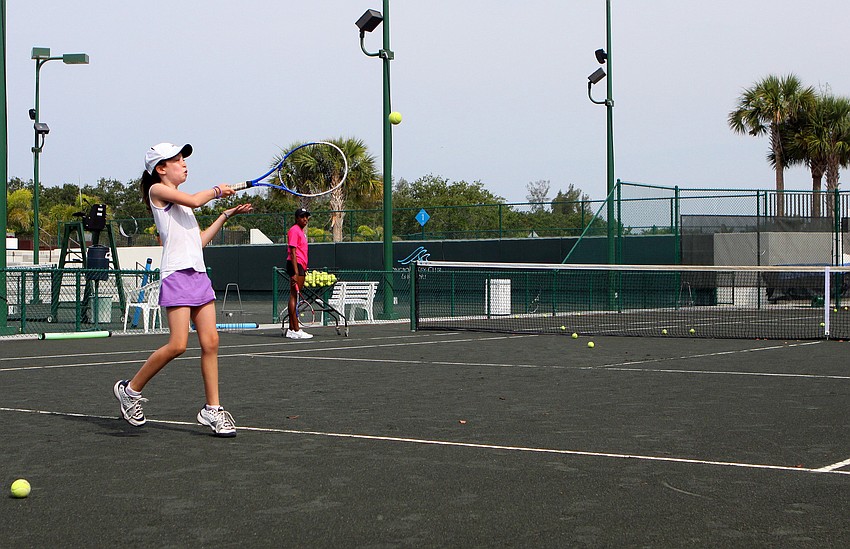 Dara Grocer hits the ball back over the net during a game of Queen of the Court Longboat Key Club's Tennis Camp Monday, June 6 at Longboat Key Club's Tennis Gardens.