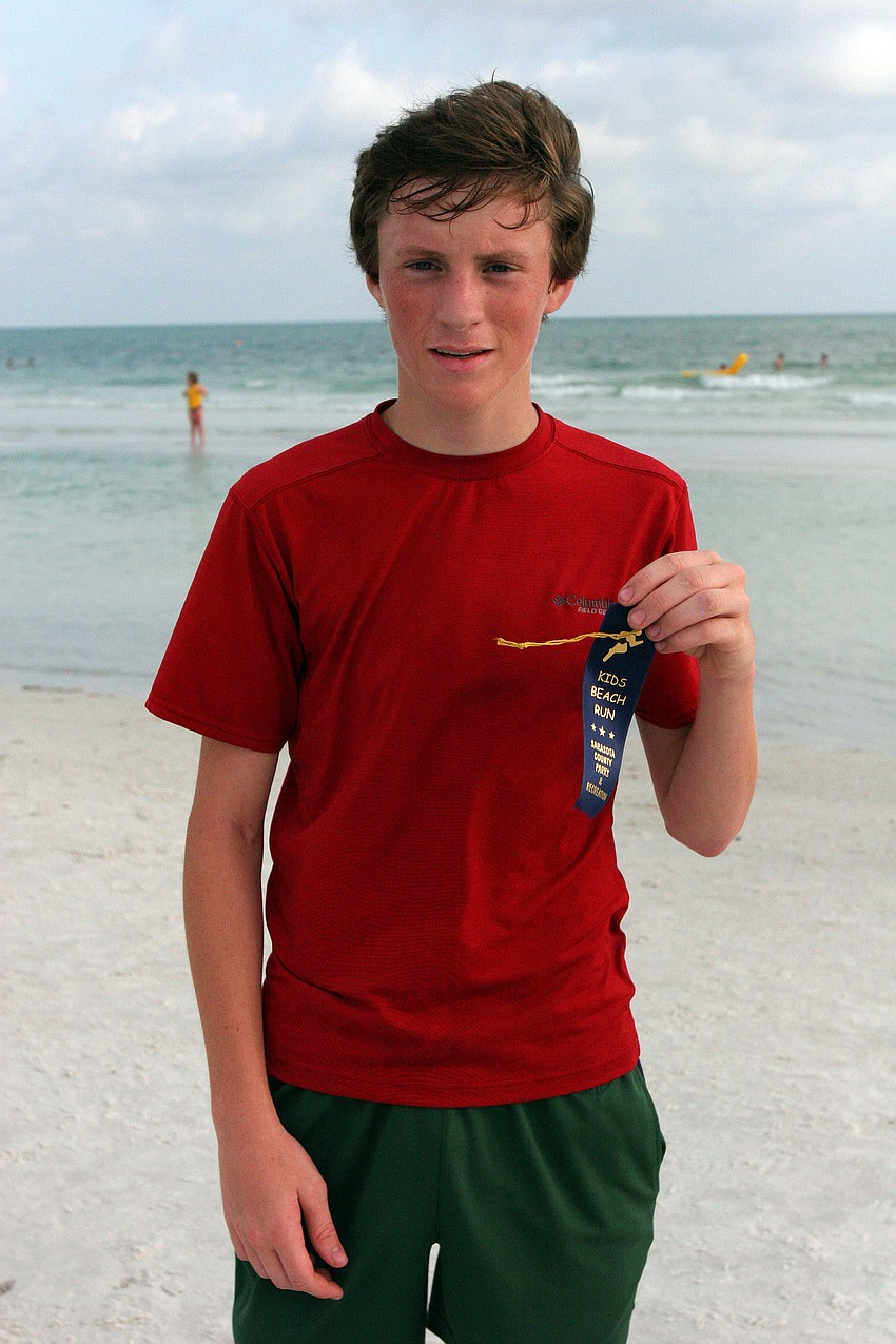 Zack Summerall, 16, was the first guy to cross the finish line in the 1-mile fun run Tuesday, June 14 on Siesta Key Beach.