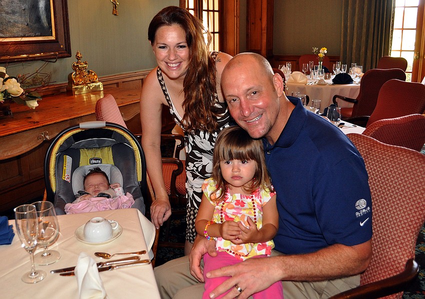 Annie, 6 weeks, Tamy, Mark and Lena, 2, Aronow pose together at the Father's Day Brunch Sunday, June 19 at the Oaks Club.