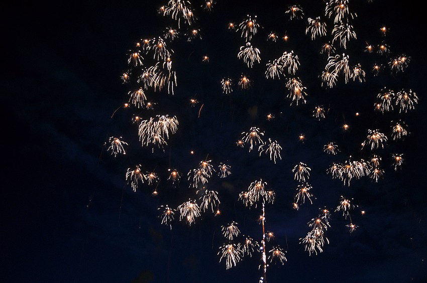 A firework starts to fade away after exploding in the night sky during the Bayfront Fireworks Spectacular Monday, July 4 at Island Park.