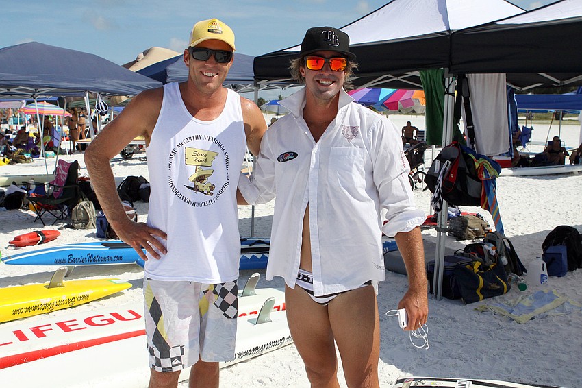 Destin lifeguards Dylan Newbiggin and Luke Turner pose together Thursday, July 14 during the 2011 James 