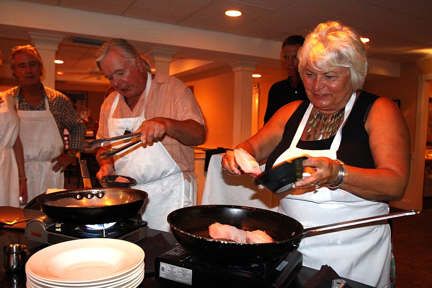 David and Marji Osborn work on making the second course for their table Friday, July 22 during the Interactive Mexico dinner at Pattigeorgeâ€™s.