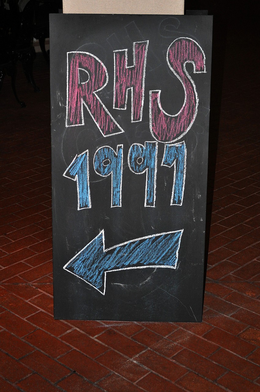 A chalkboard sign pointed towards the reunion Saturday, July 23 at Michaelâ€™s on East.