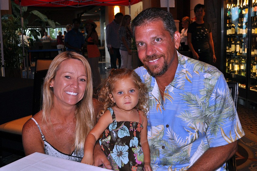 Charlotte, Addison, 2, and Perry Rohland from Tampa enjoy themselves Saturday, Aug. 20 at the Sarasota Yacht Club.