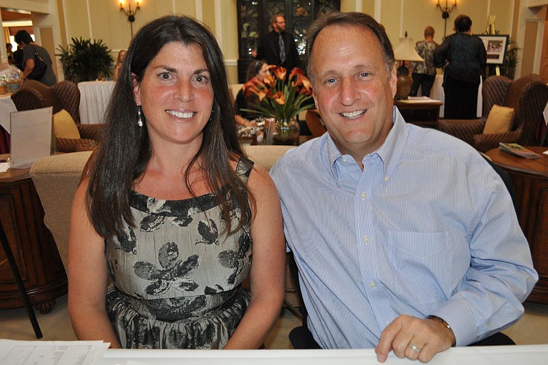 Marci Weibel and her husband Mark checked guests in.