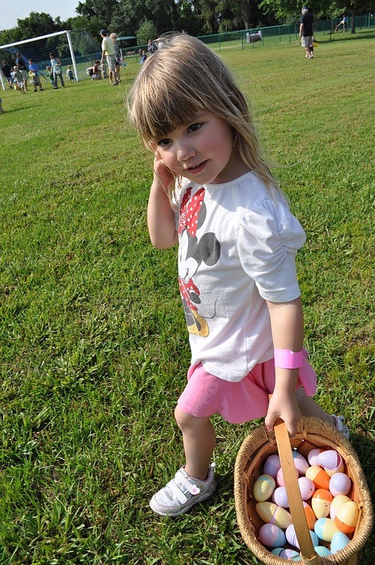 Ellie Woodward, 4, gathered as many eggs as she could.