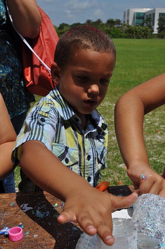 Brock Ramos, 2, decorated a candle holder.