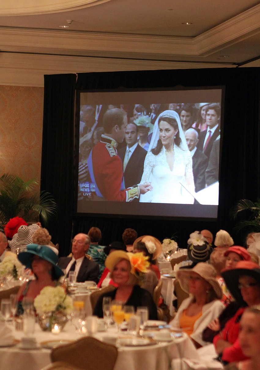People watch as Prince William says his vows to Kate Middleton Friday, April 29.