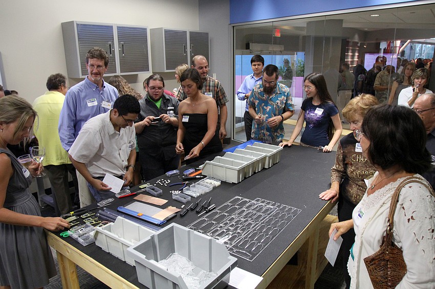 People check out the Fab Lab and create some electronic rulers at the opening of the G. WIZ Faulhaber Fab Lab Thursday, May 5 at G. WIZ.