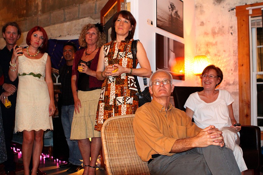 Friends and family listen to Alexis Orgera read poems from her new book 