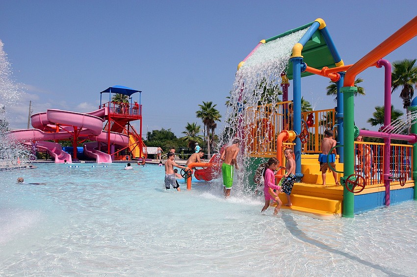 Kids cool down during a hot Florida day by playing at Potter Park.