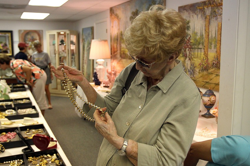 Vi Lutes looks at some of the costume jewelry.